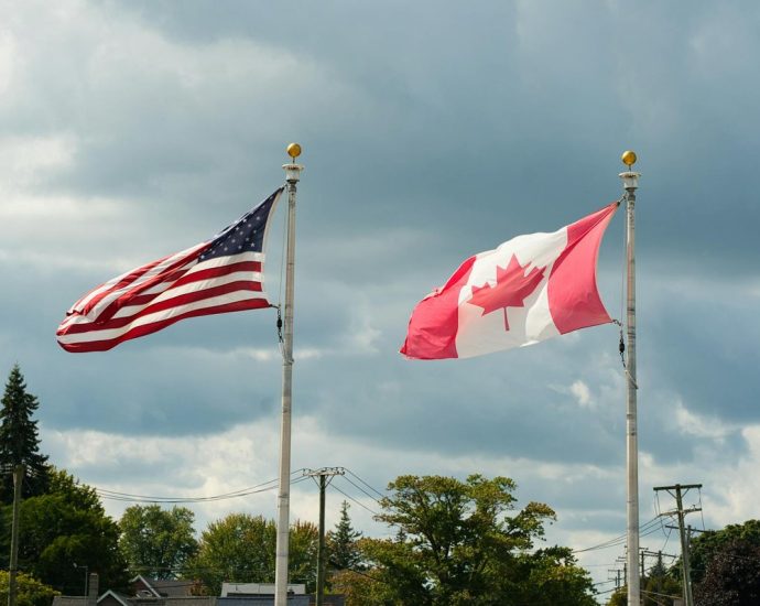 51st state - Canadian and American flags flying side by side