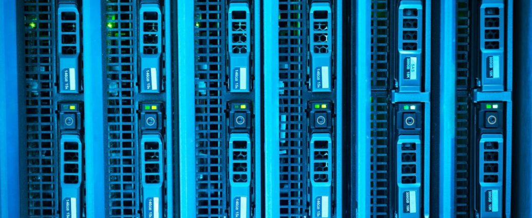 California datacenter ban - Rows of server racks inside a large data centre with blue indicator lights
