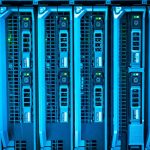 California datacenter ban - Rows of server racks inside a large data centre with blue indicator lights